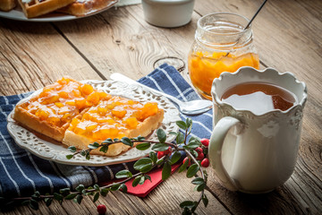 Waffles with peach jam.