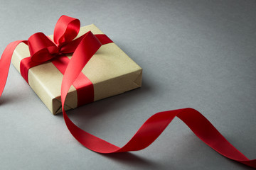Rustic gift box with red ribbon