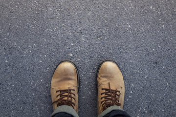  man standing on the road with jeans and boots
