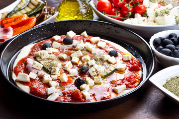 pizza with tomatoes,mozzarella,black olives and grilled vegetabl