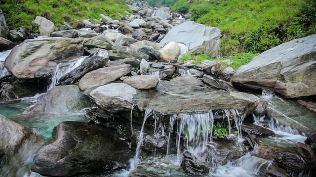 Cascade of small waterfall in mountains