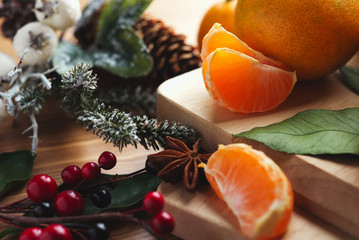 Tangerines with leaves in Christmas decor.