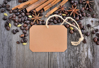 Blank paper sticker with roasted coffee beans on old wooden back