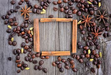 Anise star and cinnamon sticks in the frame made from roasted co