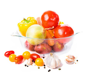Vegetables in a glass pot isolated on white background