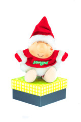 Santa Claus doll with a big gift box isolated on white backgroun