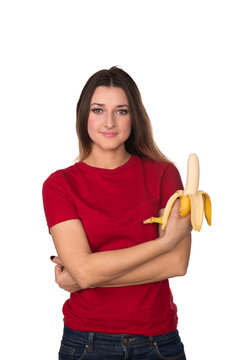 A young girl with a banana