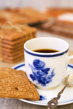 Cup of coffee with a typical Dutch speculaas cookie