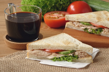 Fototapeta na wymiar Tuna Sandwich with black coffee