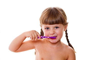 dental hygiene. happy little girl brushing her teeth © Lsantilli
