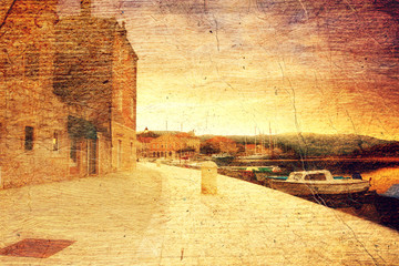 empty quay of mediterranean town Starji Grad at sunset (Croatia, Hvar). Picture in artistic retro style.