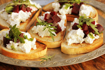 Bruschetta with beet, feta and ruccola