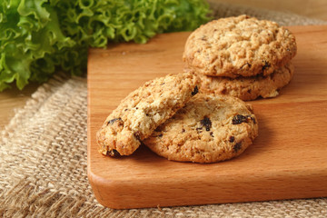 Oat raisin cookies on chopping board