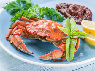 Cooked crab with lemon and herbs.