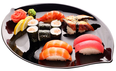 Sushi on the black plate. Traditional japanese food.