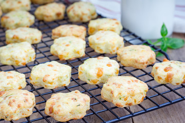Fresh baked cheese cookies with basil, closeup