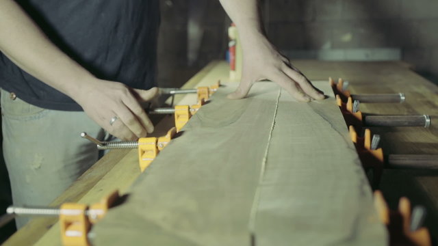 joiner glues two workpiece of wooden plank together