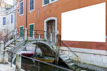 Blank billboard with copy space on the wall in Venice, Italy