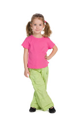 Fashion little girl is standing against the white