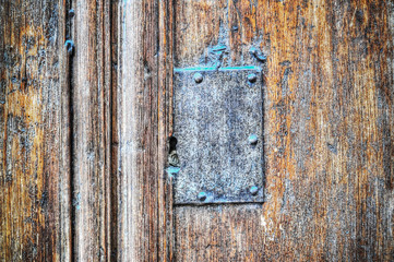 old metal plate in a wooden background