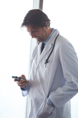 doctor speaking on cellphone