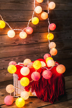 Cotton Christmas garland. Bright multi-colored decoration.