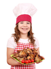 happy little girl cook with chicken wings
