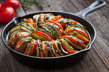 Traditional homemade vegetable ratatouille baked in cast iron frying pan healthy diet french...