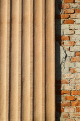 Plastered ribbed and bricks facade