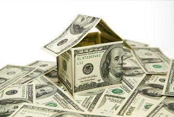 US dollar banknotes on display in the shape of a house on over w