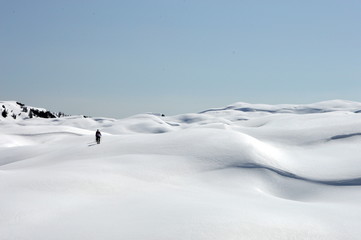 Fototapeta na wymiar Relief of snow covered mountains