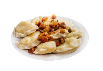 Ukrainian potato dumplings - Vareniki  with greaves. Isolated on