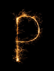 Sparkler firework light alphabet P at night - obrazy, fototapety, plakaty
