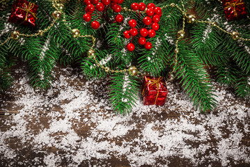 Beautiful Christmas wooden background with snow fir tree. View with copy space