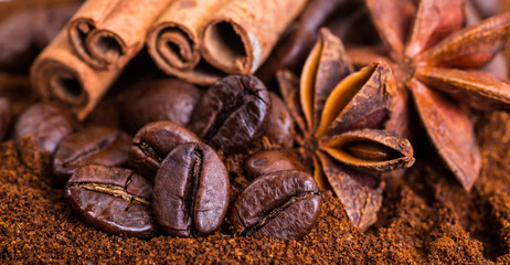 Close-up of coffee beans on pile of roasted coffee. Coffee beans