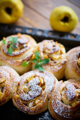 Obraz na płótnie Canvas sweet rolls with quince