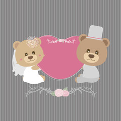 Wedding concept of couple teddy bear doll holding pink heart