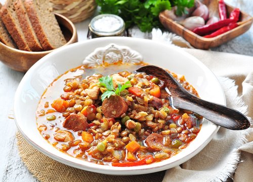 Lentil soup with chicken and pepperoni sausage, onion, carrot, sweet pepper, garlic and parsley.