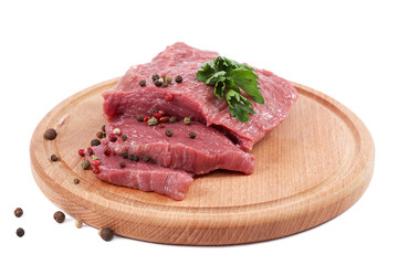 Meat on a cutting board on white background.