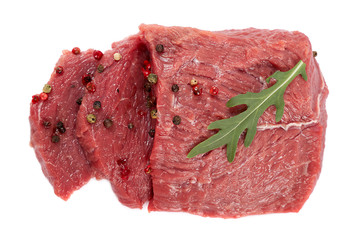 Raw meat and spices on white background.
