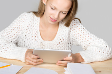 Girl studying with tablet