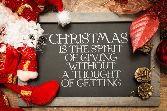 Blackboard with the text: Christmas is the Spirit of Giving Without a Thought of Getting