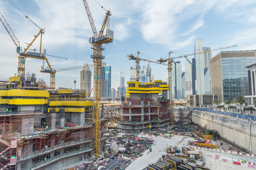 Lots of tower cranes build large residential buildings - Construction site © oneinchpunch