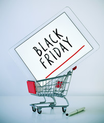 tablet with text black friday in a shopping cart