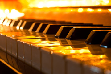 The keyboard of the piano in the golden light © furtseff