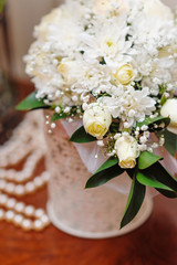 white wedding bouquet in a vase on the table