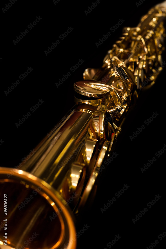 Poster lying soprano sax closeup on a black background