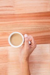 Woman hands holding cup of coffee