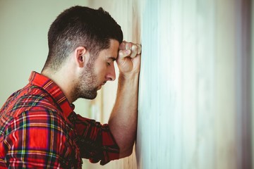 Handsome hipster feeling stressed out