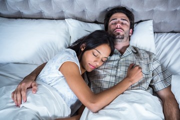 Couple sleeping together